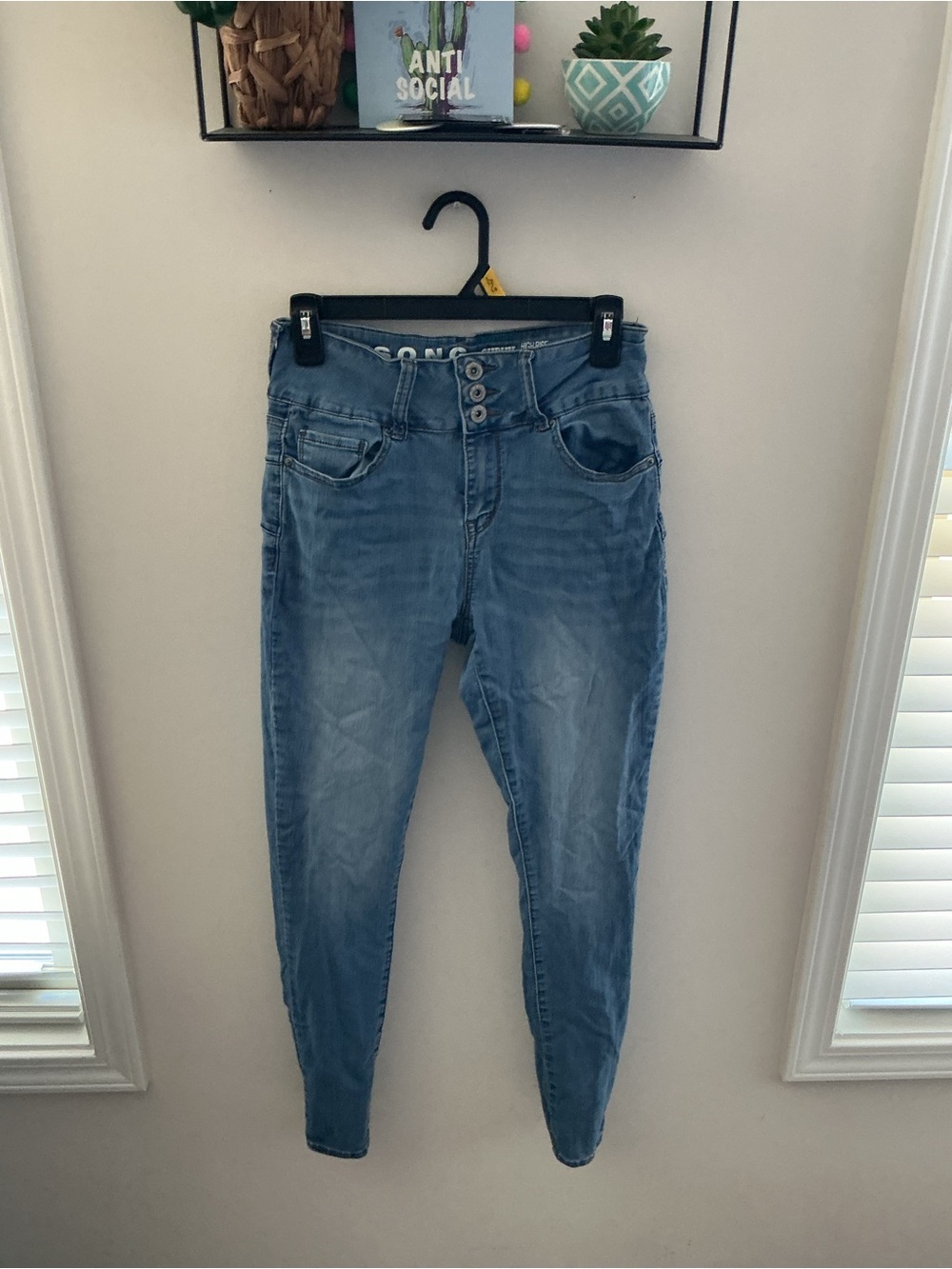 High-Rise Light Blue Skinny Jeans with Button Fly